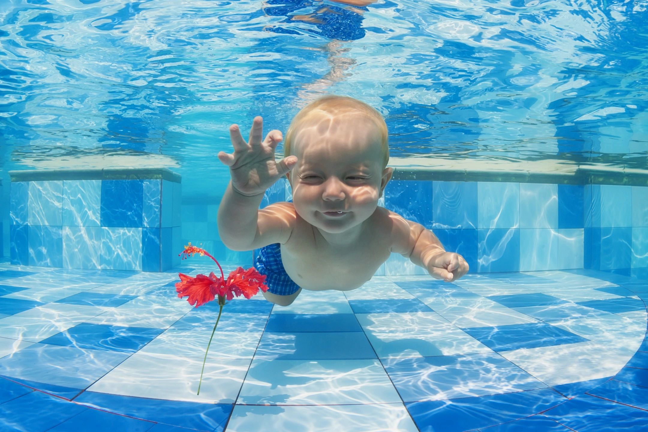 Child swimming with Coach Jared
