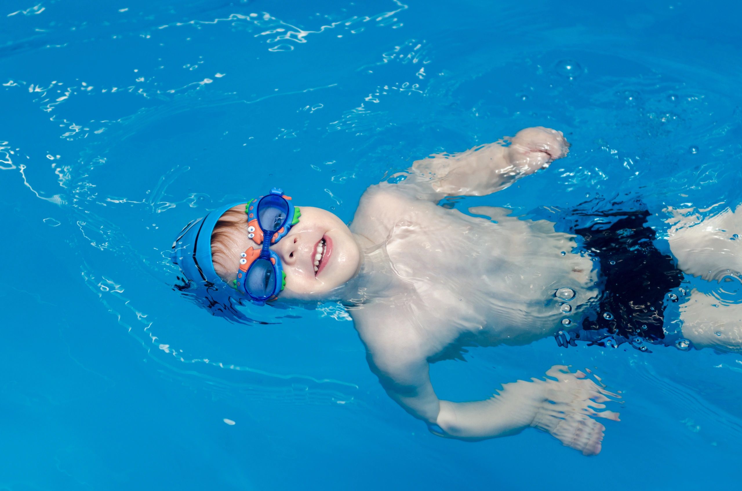 Child learning to swim with Coach Jared