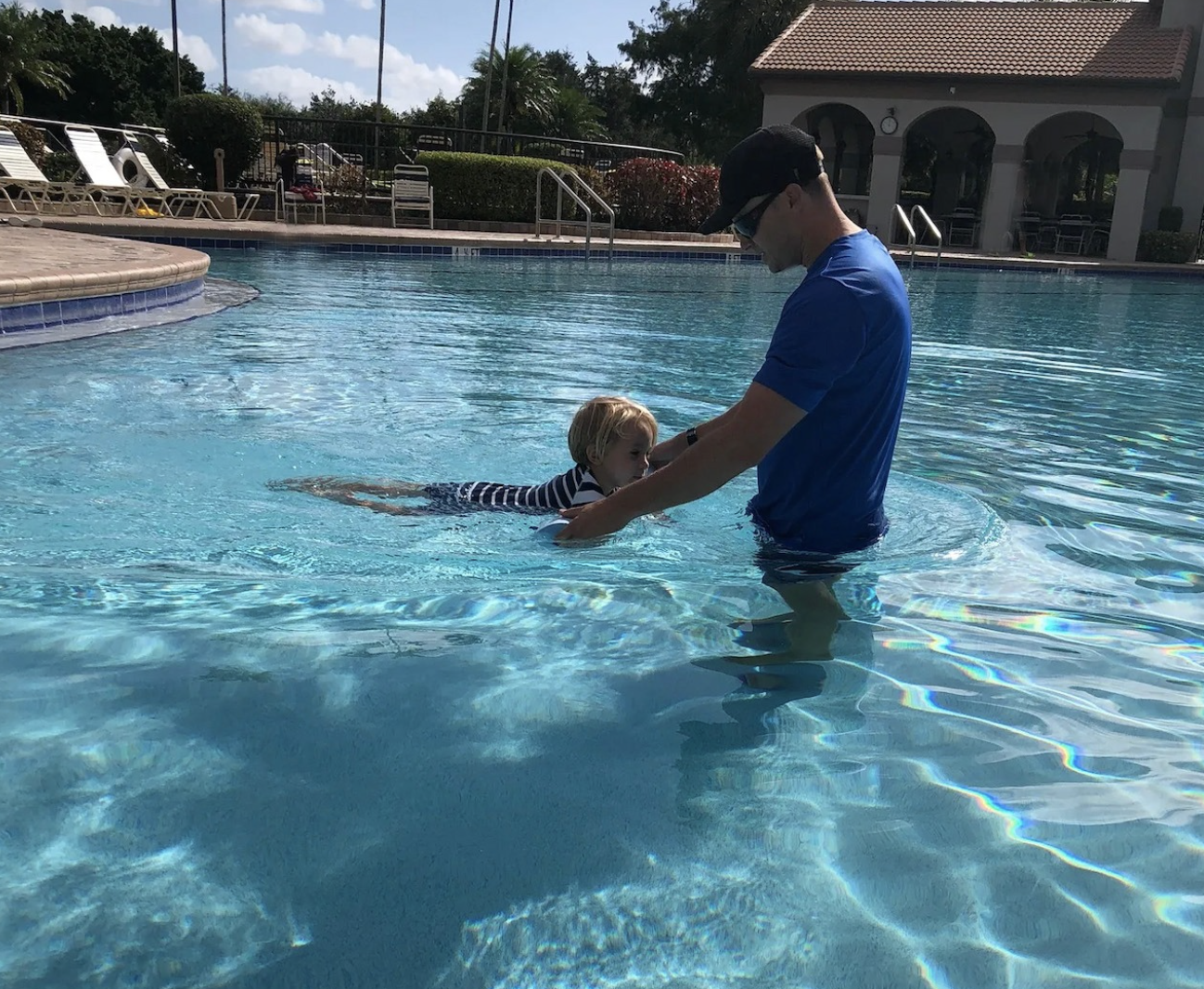 Toddler learning to swim with Coach Jared